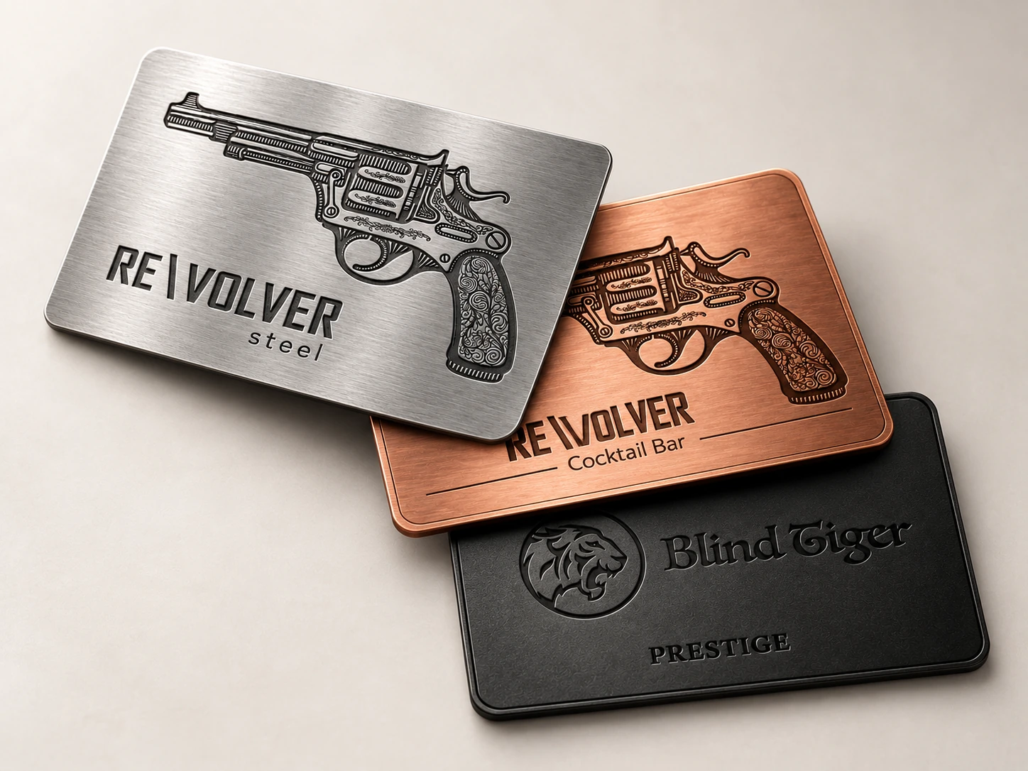 Steel, Copper and Blind Tiger Prestige RE\VOLVER membership cards stacked and splayed